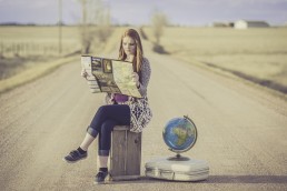 lady with suitcase and map