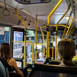 people sitting down inside vehicle